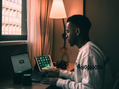 man using laptop inside room
