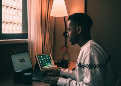 man using laptop inside room